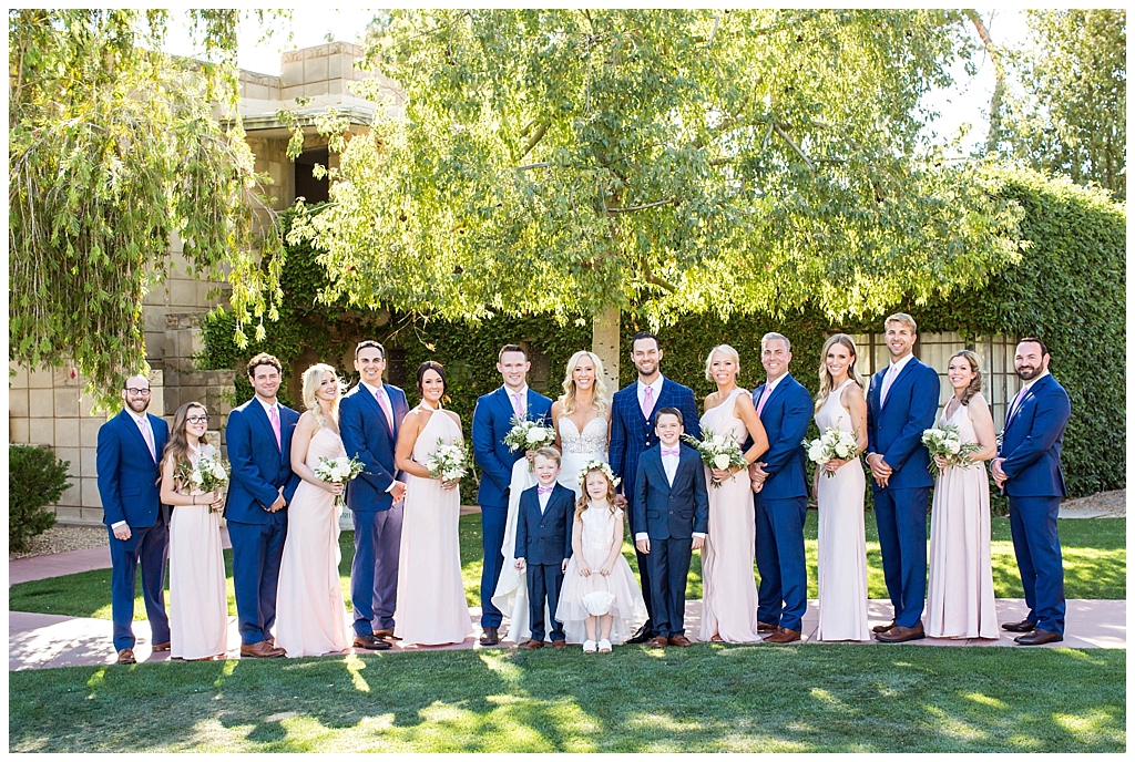 wedding party in navy and blush colors