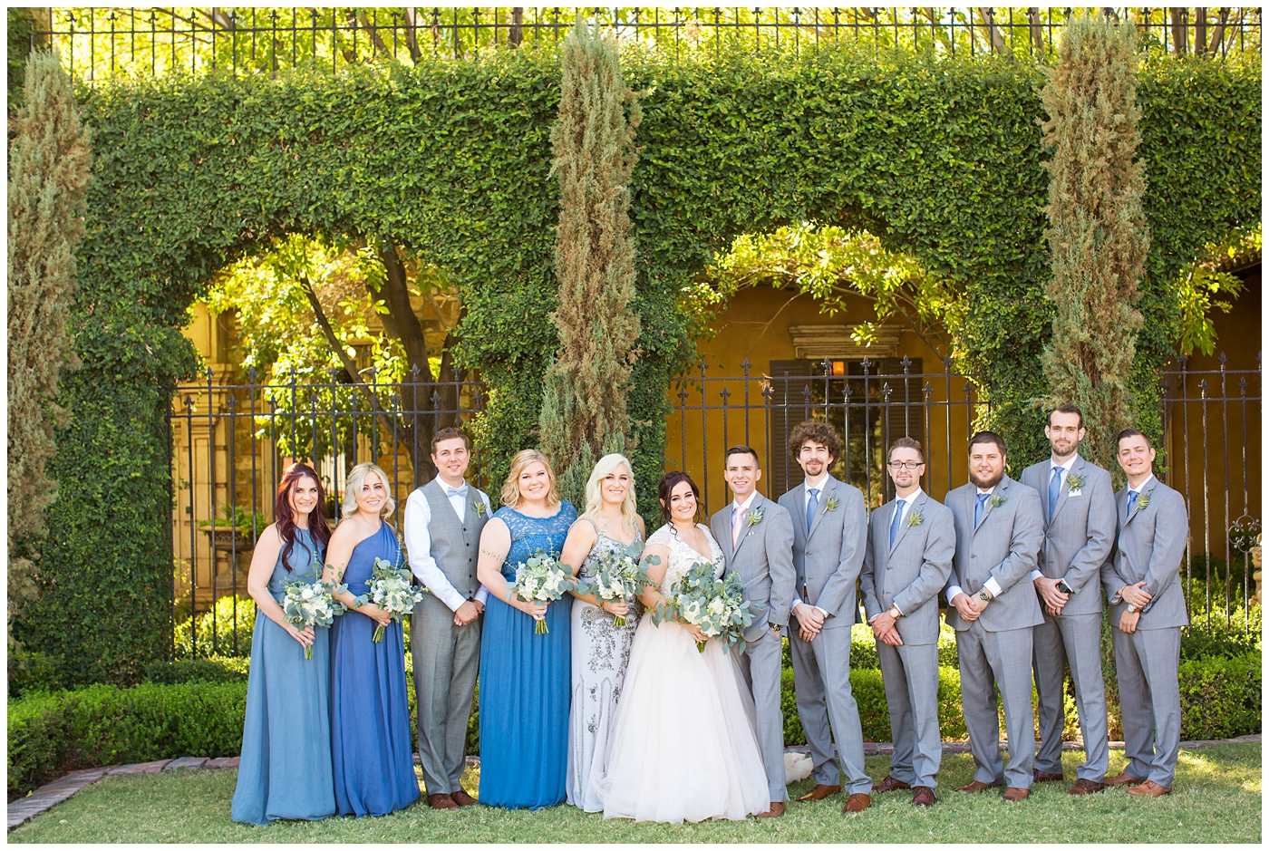Large wedding party group in gray and blues