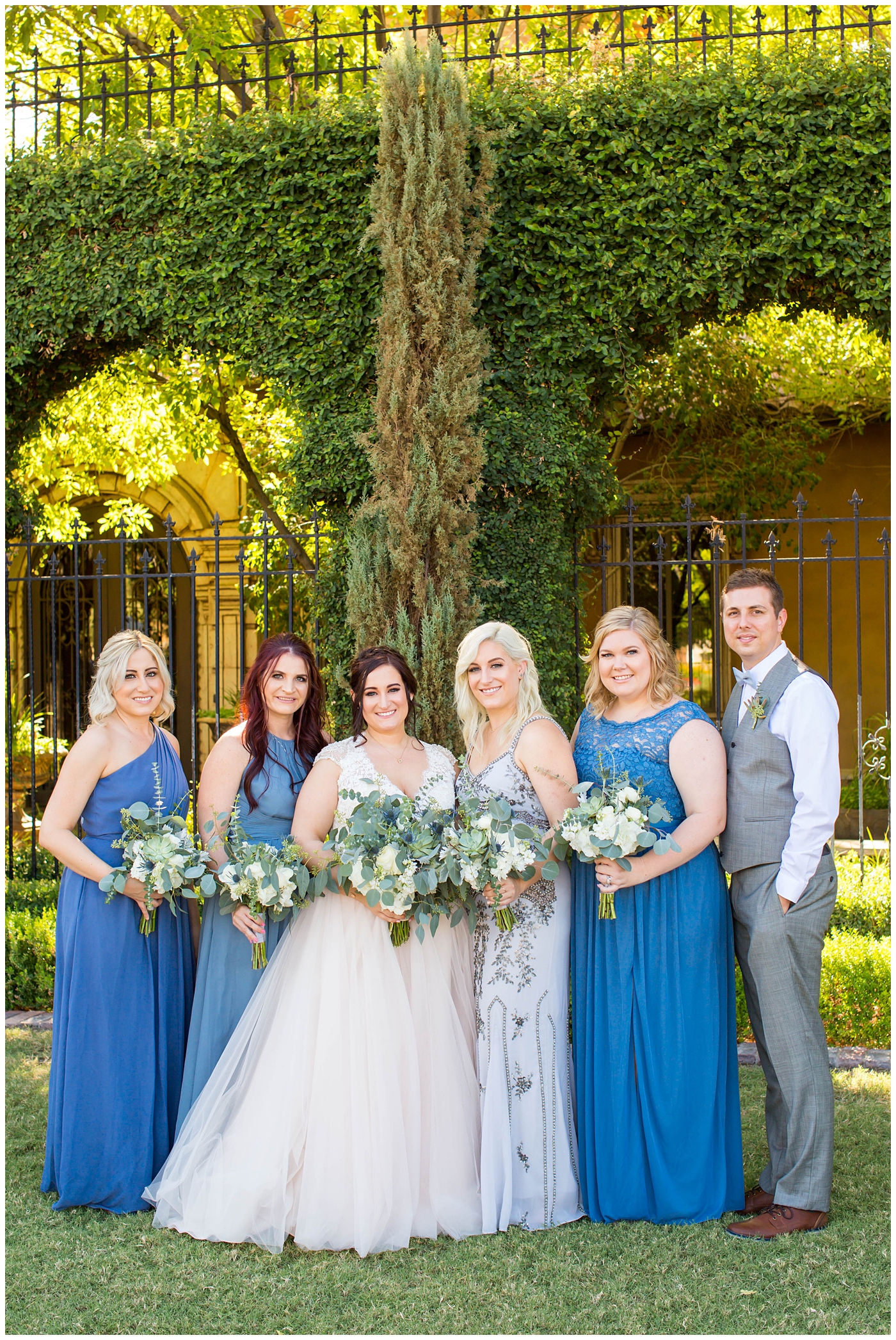 Bridesmaids and bridesman in gray and blue