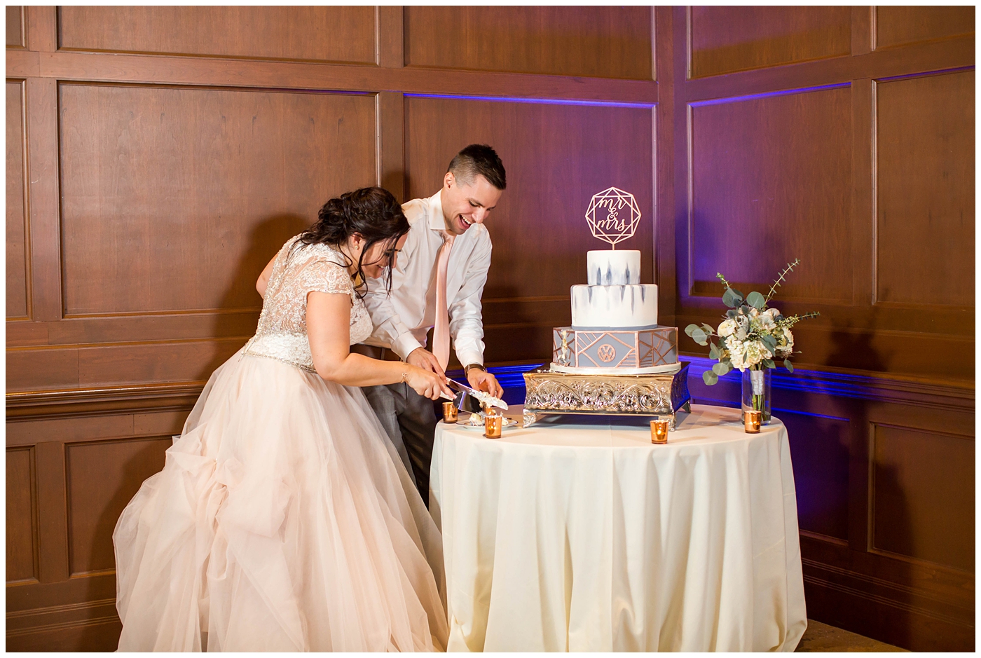 Bride and Groom cutting geometric cake
