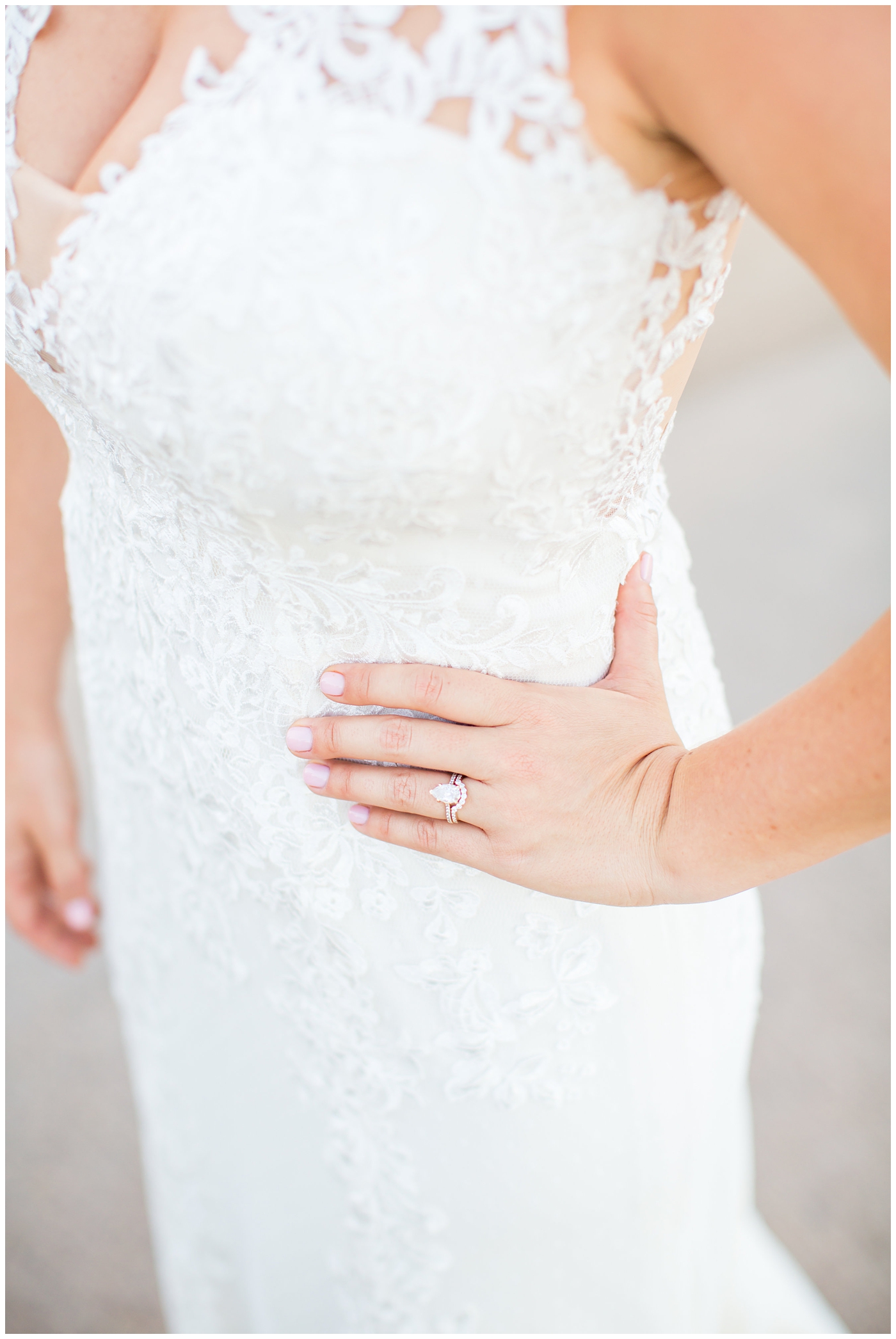 Close up of Justina Alexander wedding dress and ring on bride