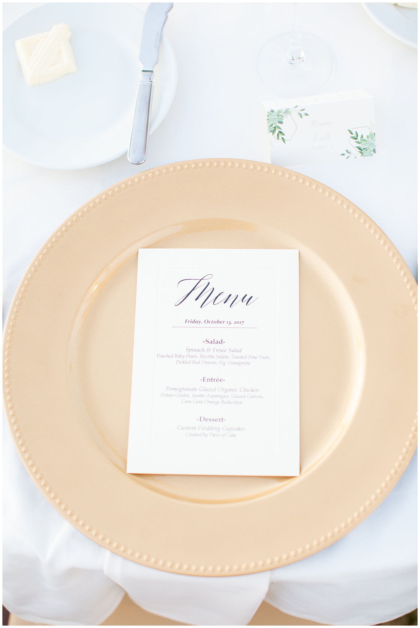 gold charger plate and custom menu at wedding reception