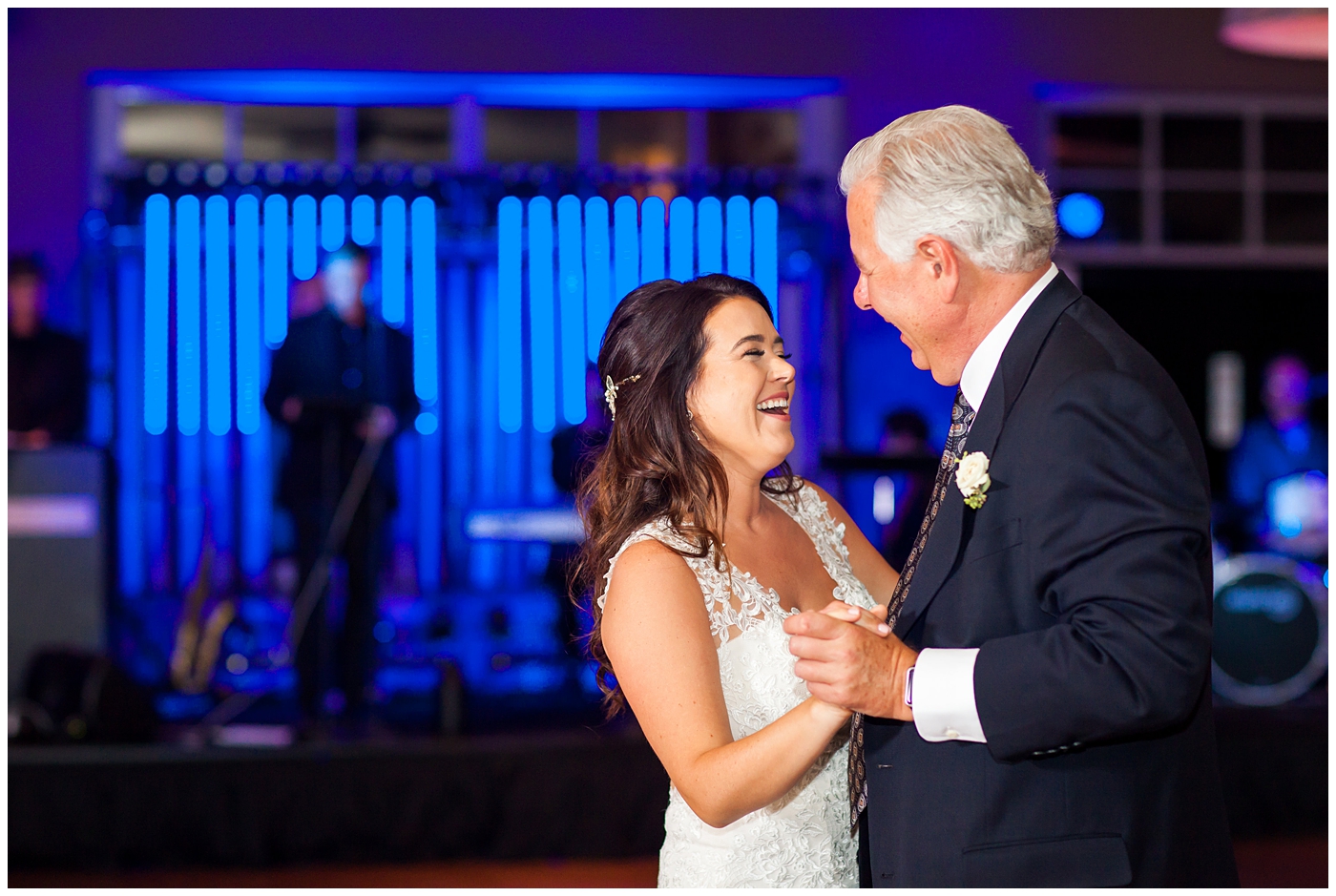 Gorgeous brunette bride in Justina Alexander wedding dress dancing with her father at wedding reception