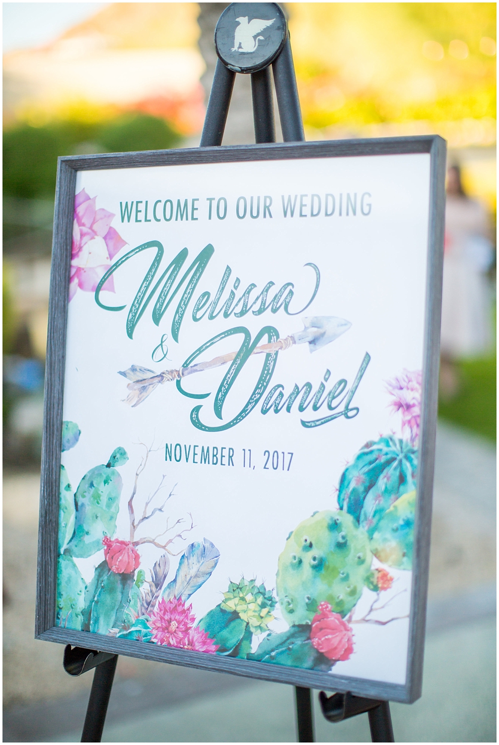 wedding ceremony welcome sign with cactus