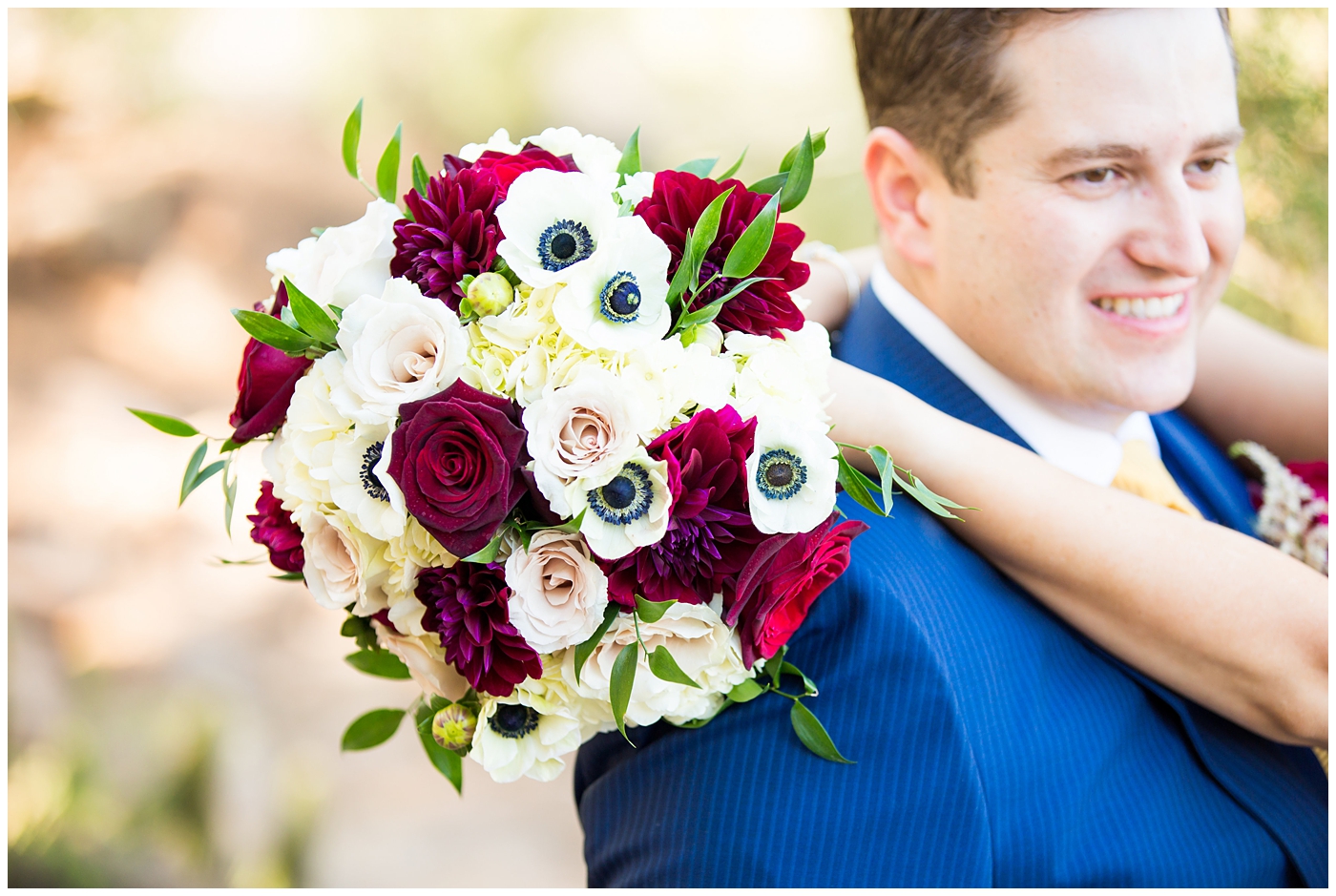 red and white roses with white ranunculus wedding bouquet