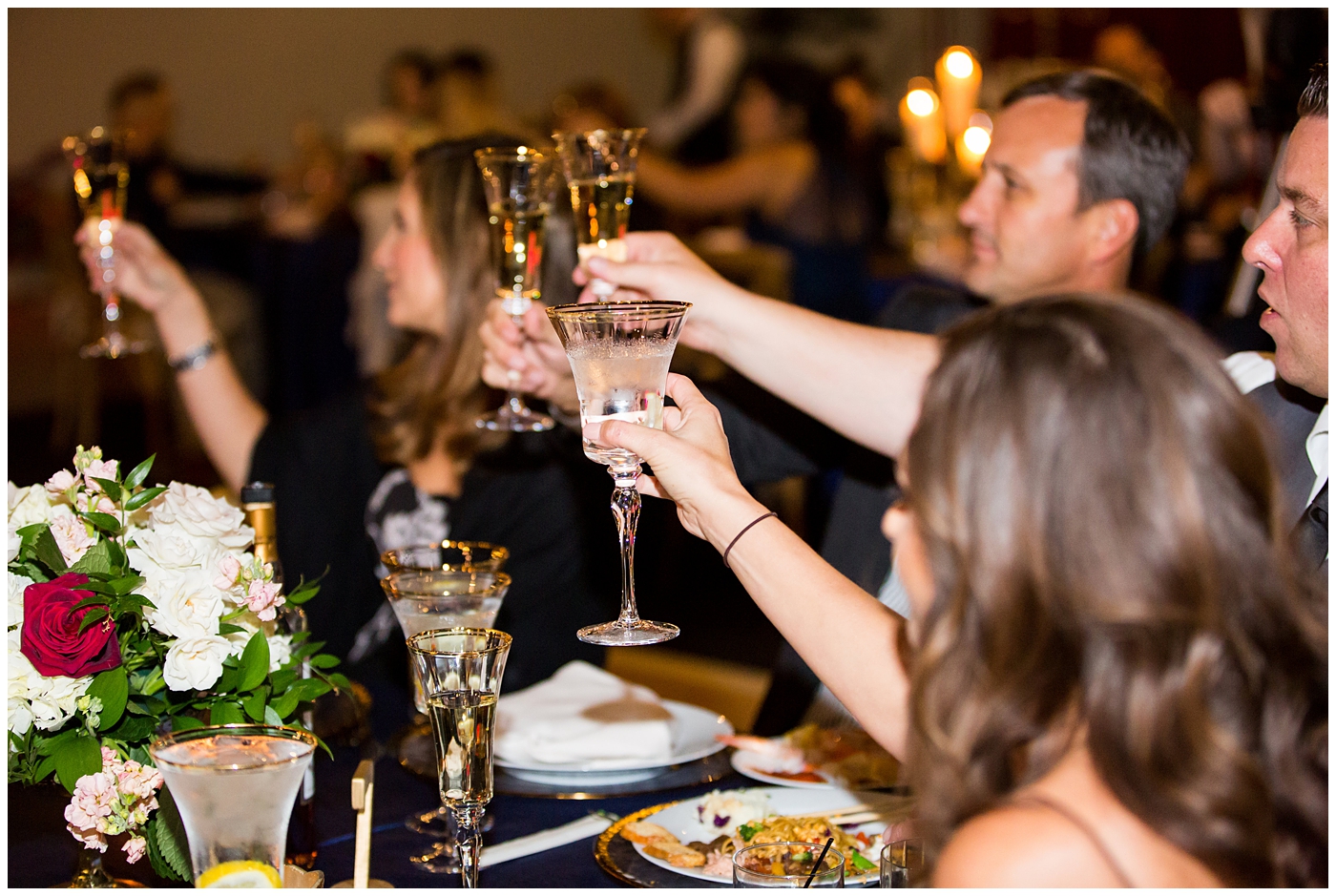 wedding toast with gold rimmed glass cups