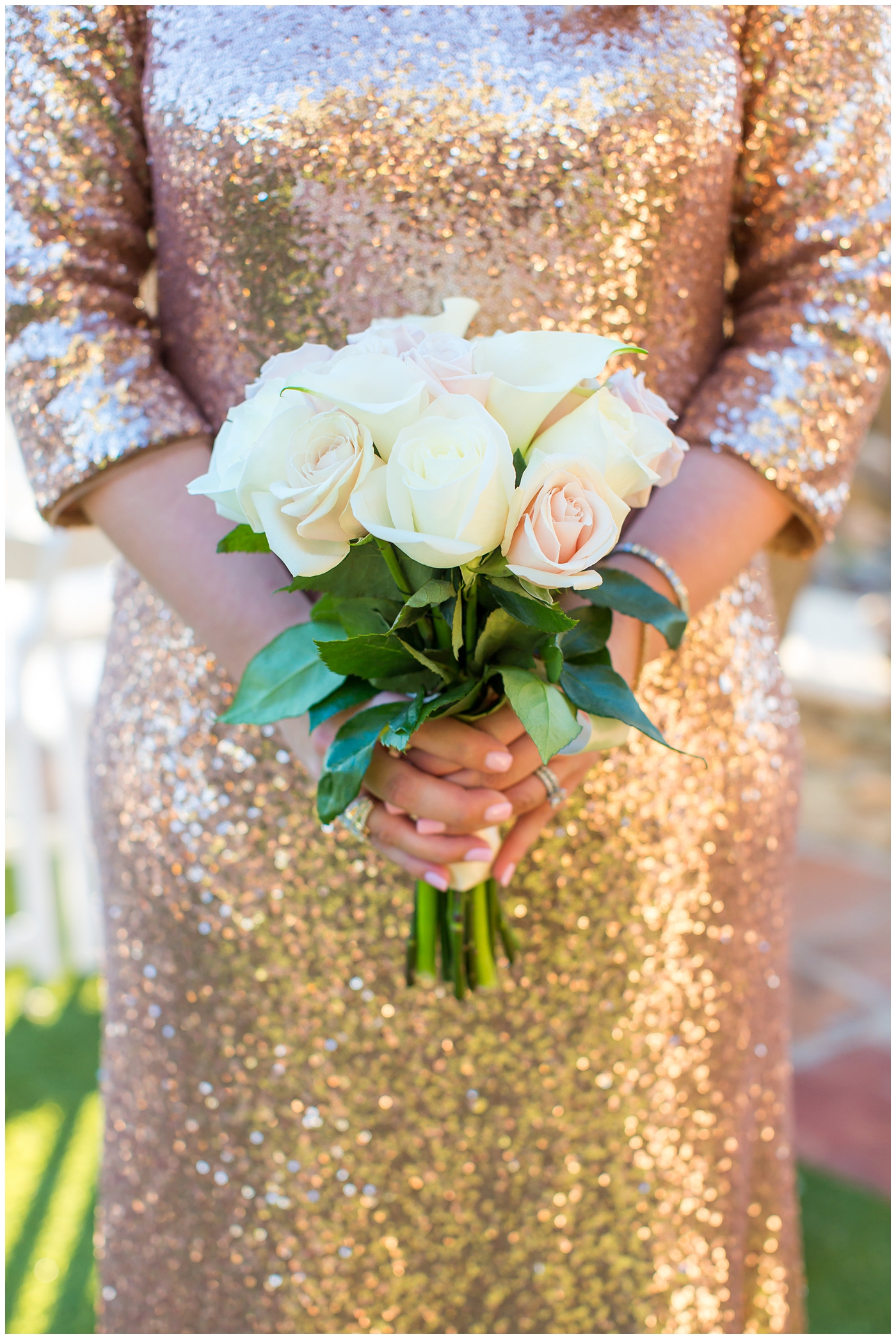 bridesmaid in sequin dress holding white and pink bouquet