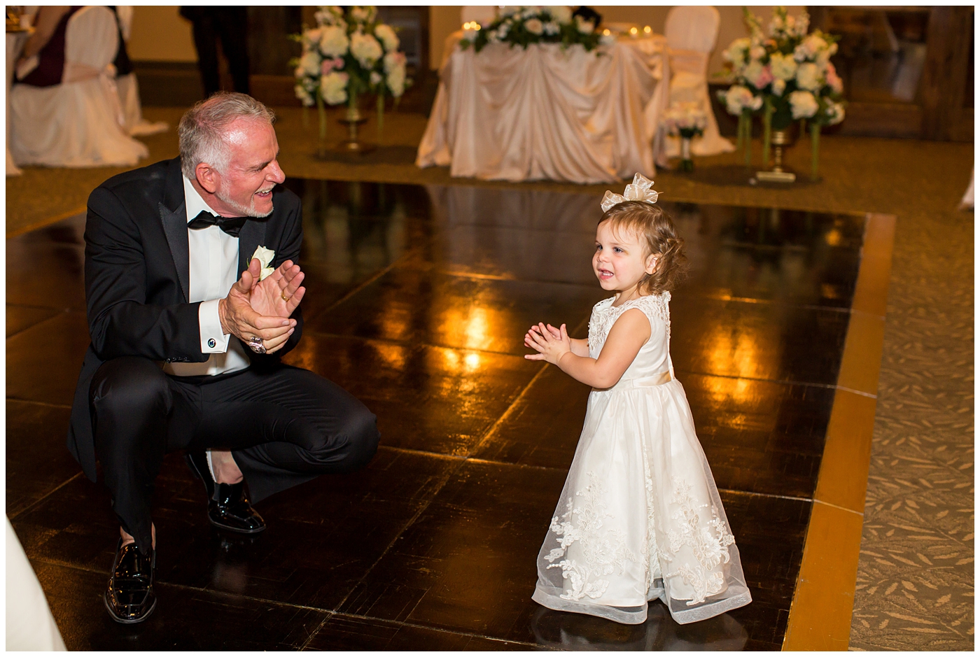 groom in black tux with granddaughter