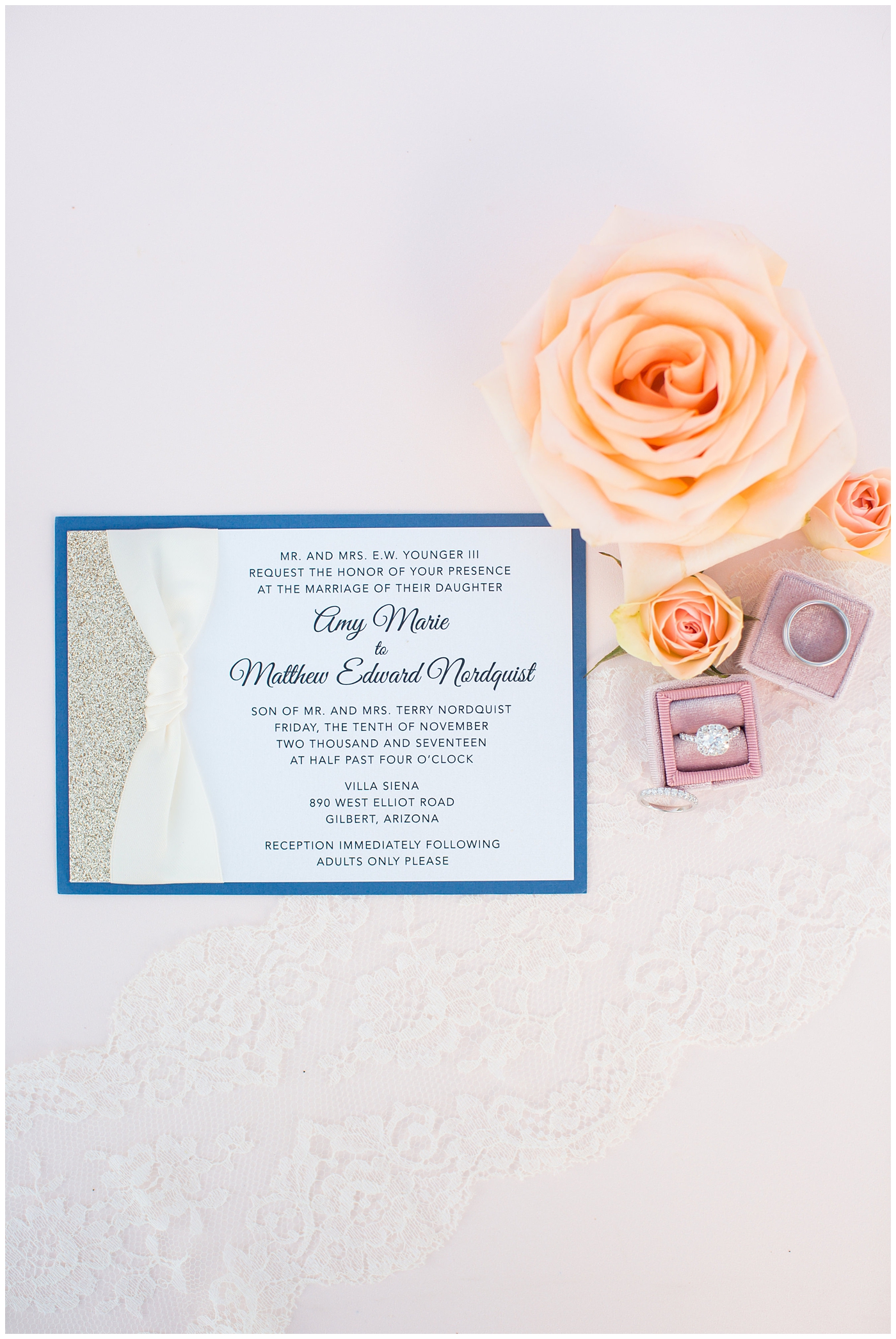 paper invite with wedding rings and bands in pink mrs box with pink rose