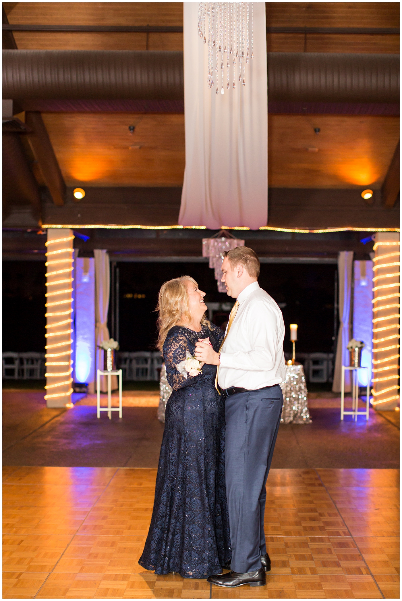 mother son dance during wedding reception in ballroom