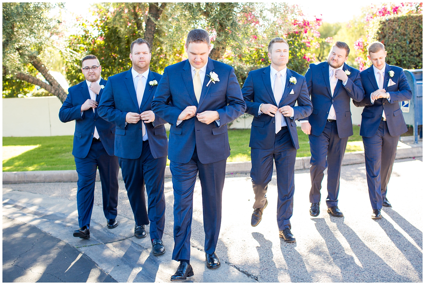 groom and groomsmen in navy blue suits
