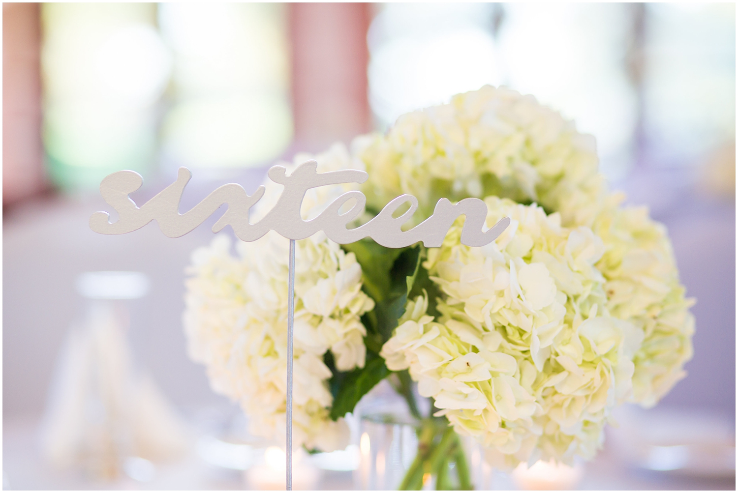 white hydrangeas and white table number wedding day reception details