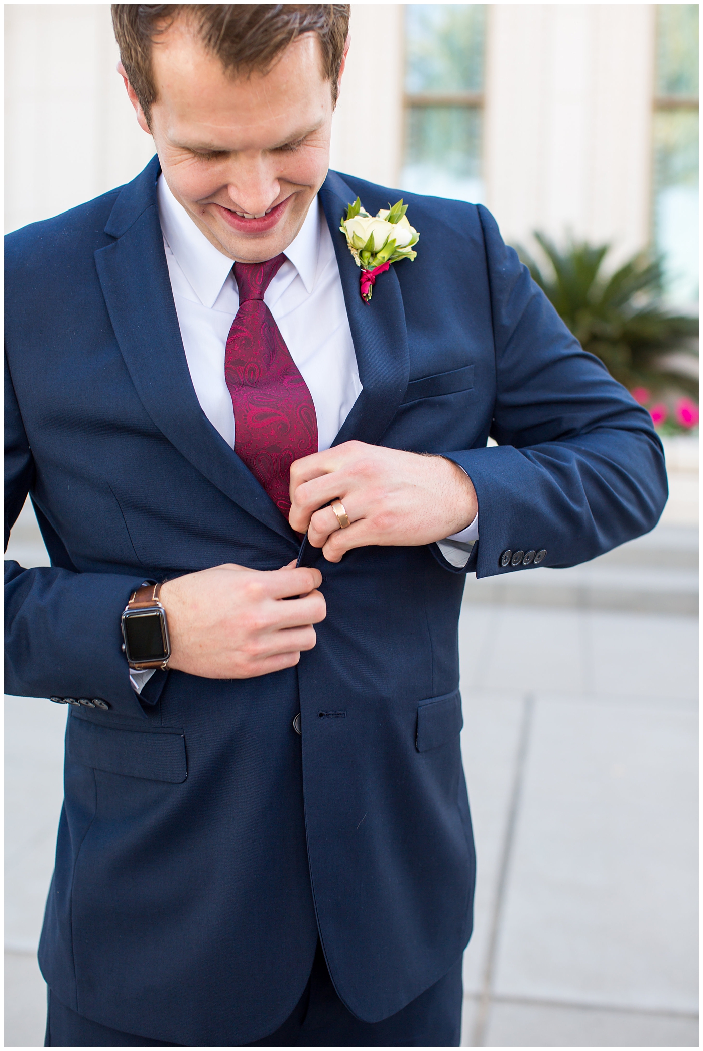 groom in navy suit with burgundy tie wedding day portrait at Gilbert LDS temple