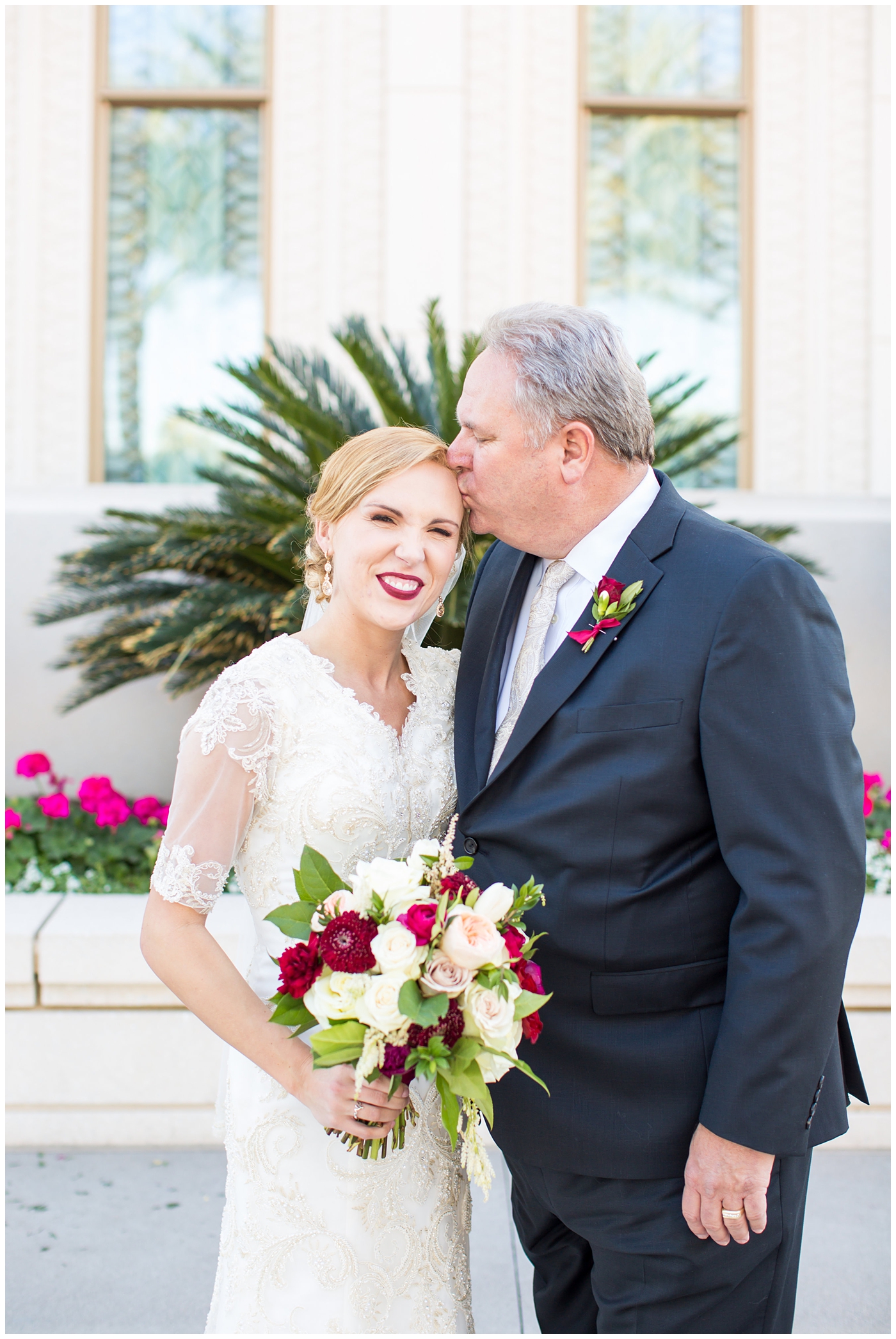 bride in sleeved lace dress with burgundy, white, and green wedding bouquet wedding day portrait with father at Gilbert LDS temple