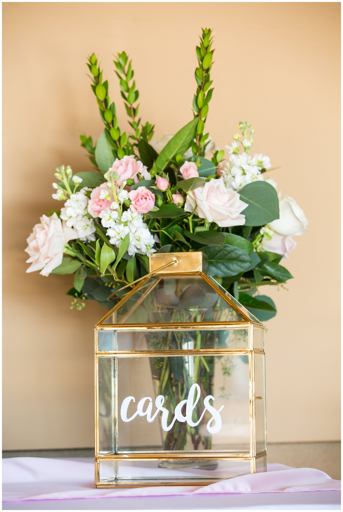 gold and glass card box with pink and greenery wedding reception detail