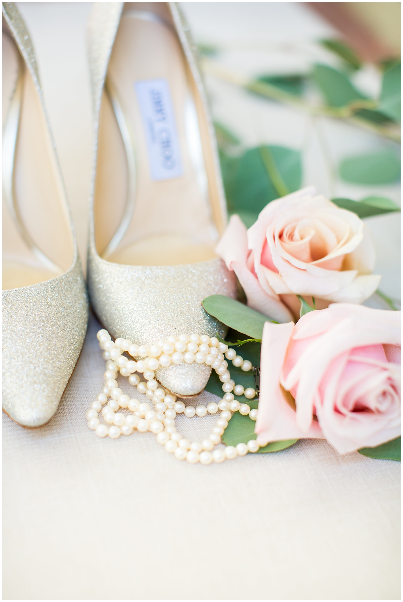 shiny gold jimmy choo wedding day shoes with bride's grandma pearl neckalace