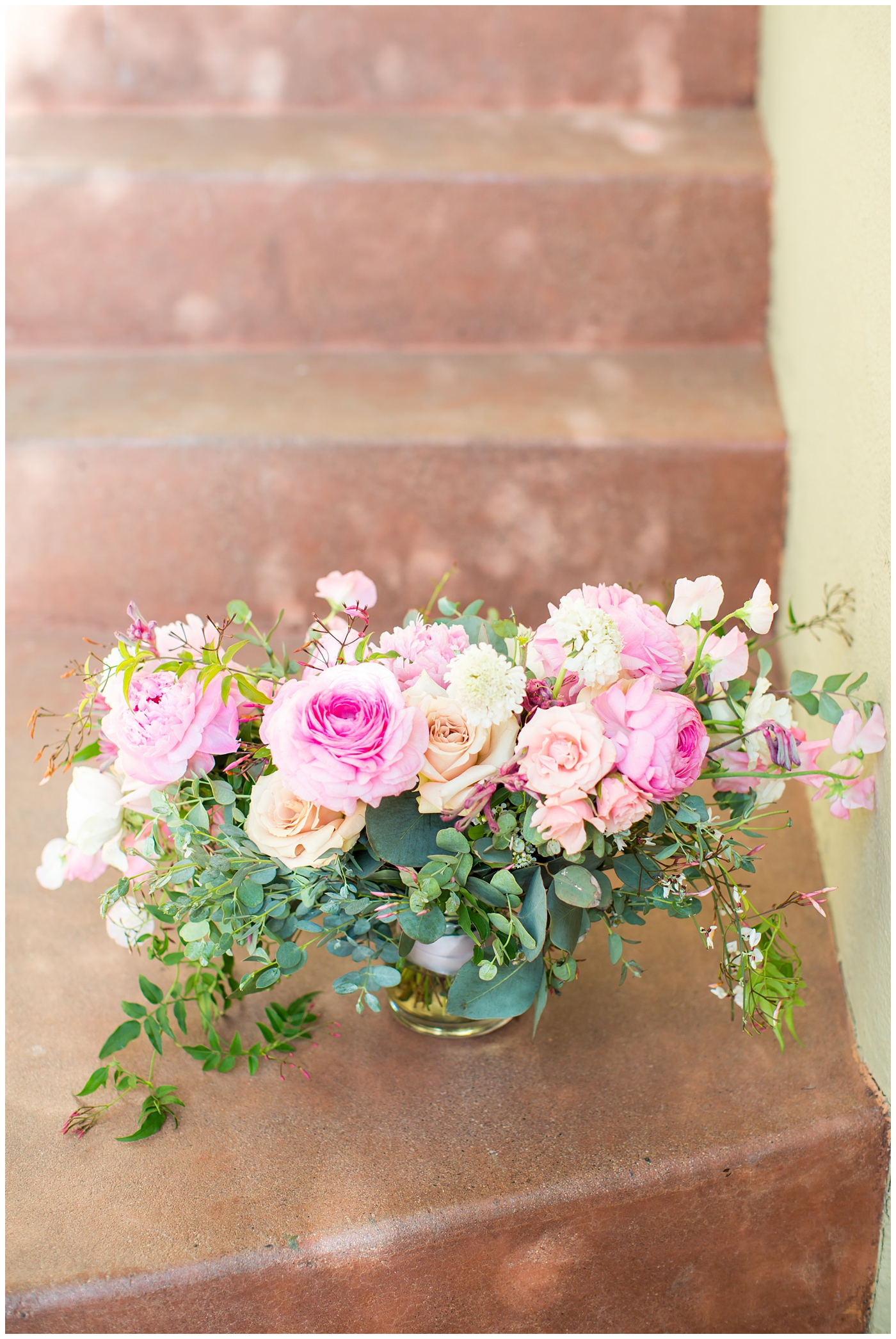 pink peony, roses, light coral rose and loose greenery bridal bouquet