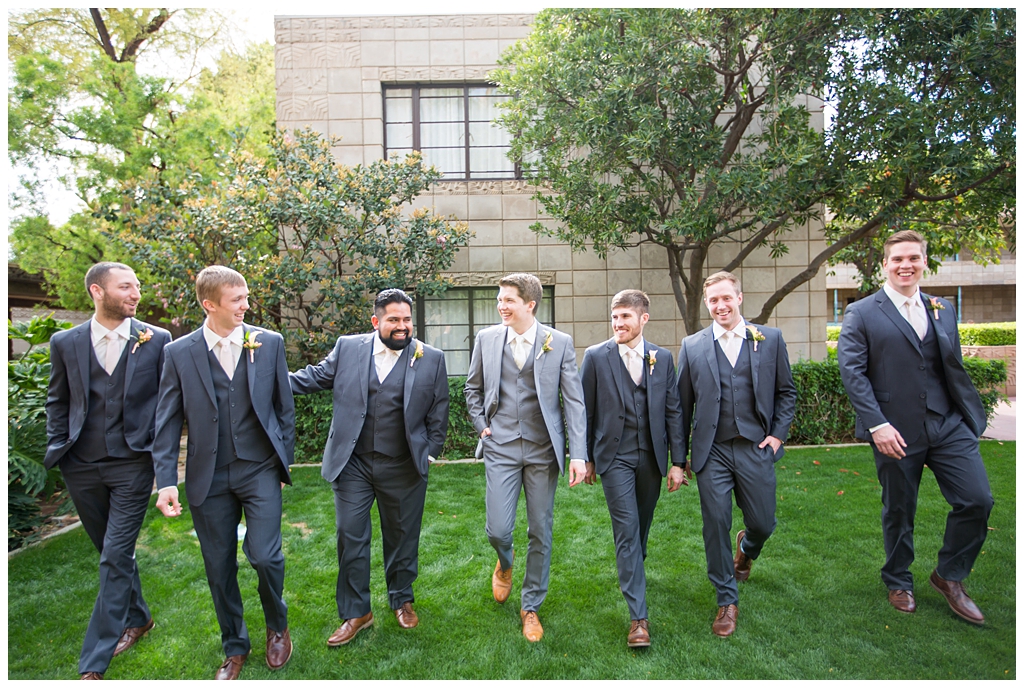 groom in light gray suit with tie with groomsmen in dark gray suits portraits at Arizona Biltmore