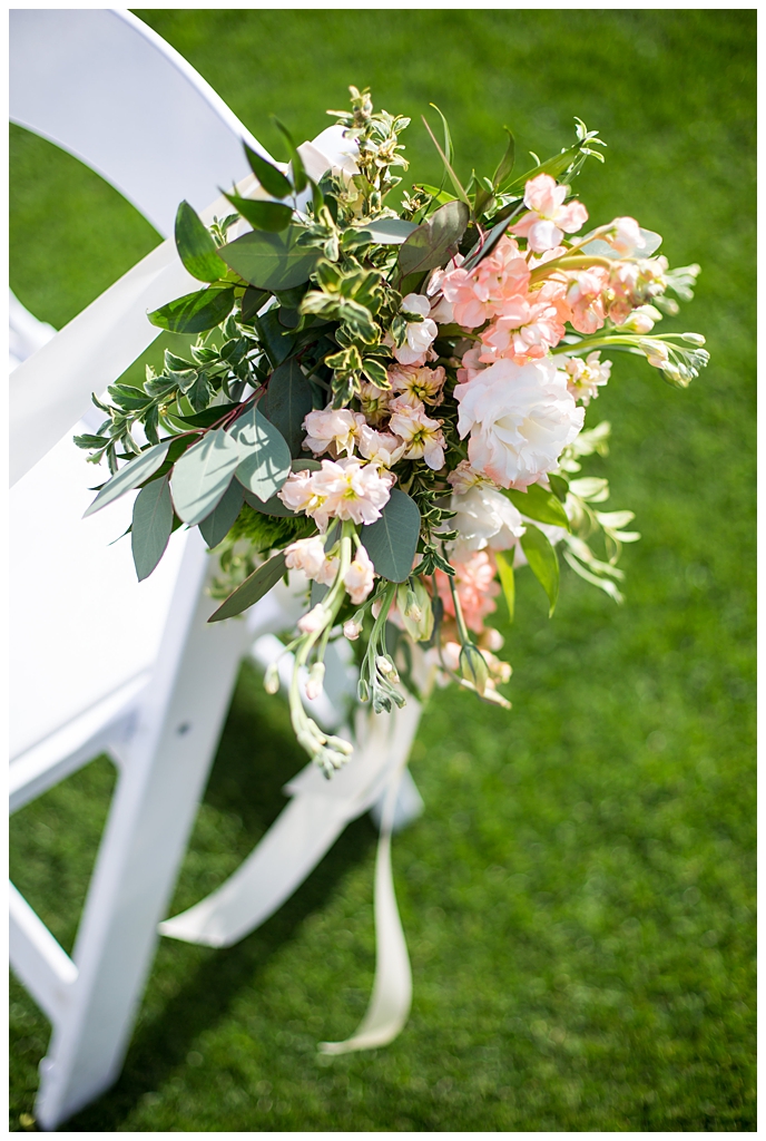floral arrangement for chair with pastel wildflowers and greenery