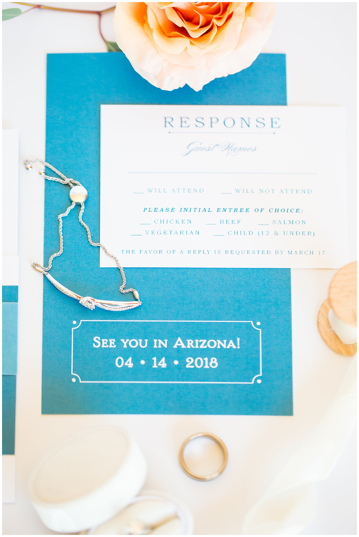 wedding invitation suite flat lay blue invites with white rsvps, sparkle shoes and mrs box details