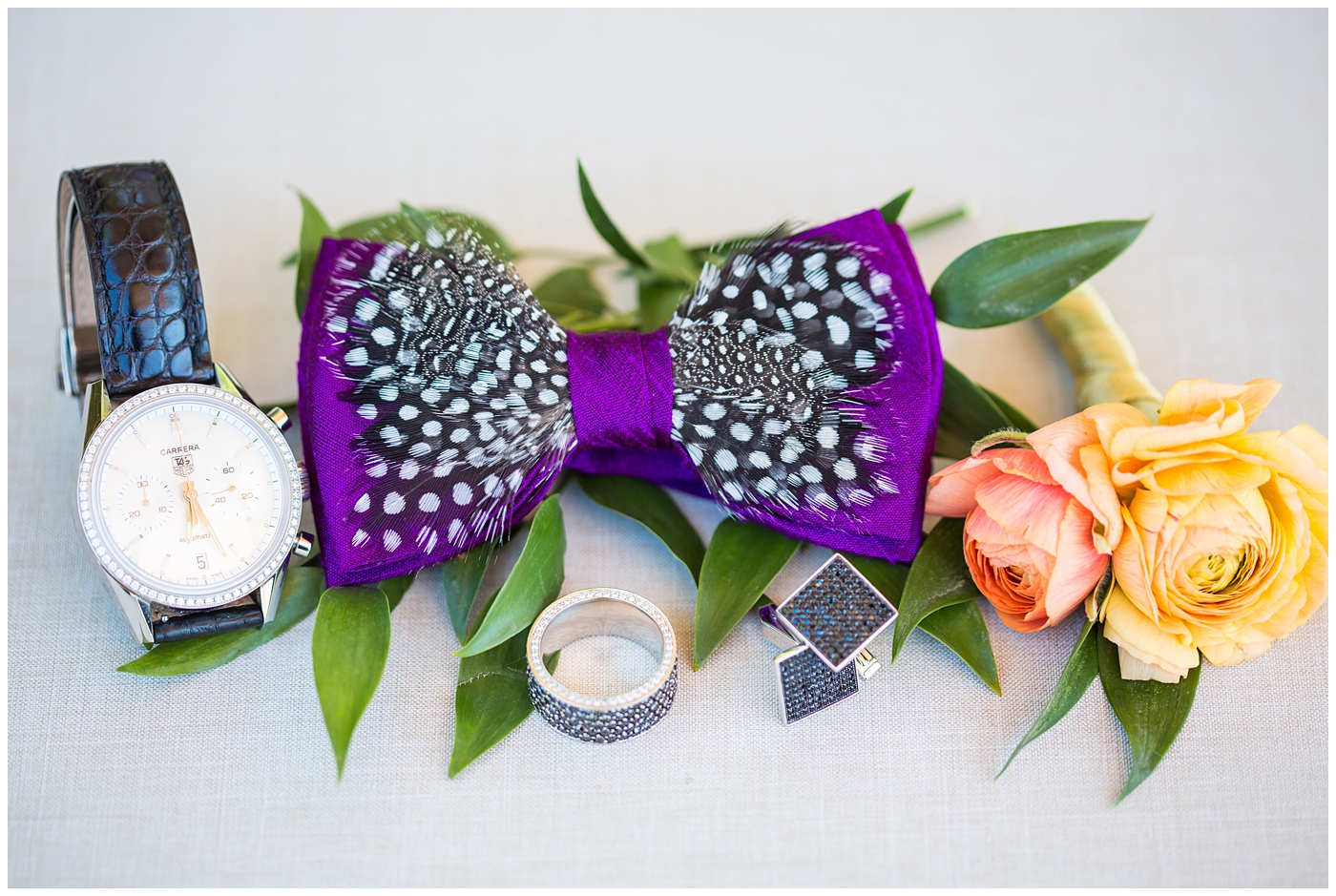 purple bowtie with black and white feather wedding day