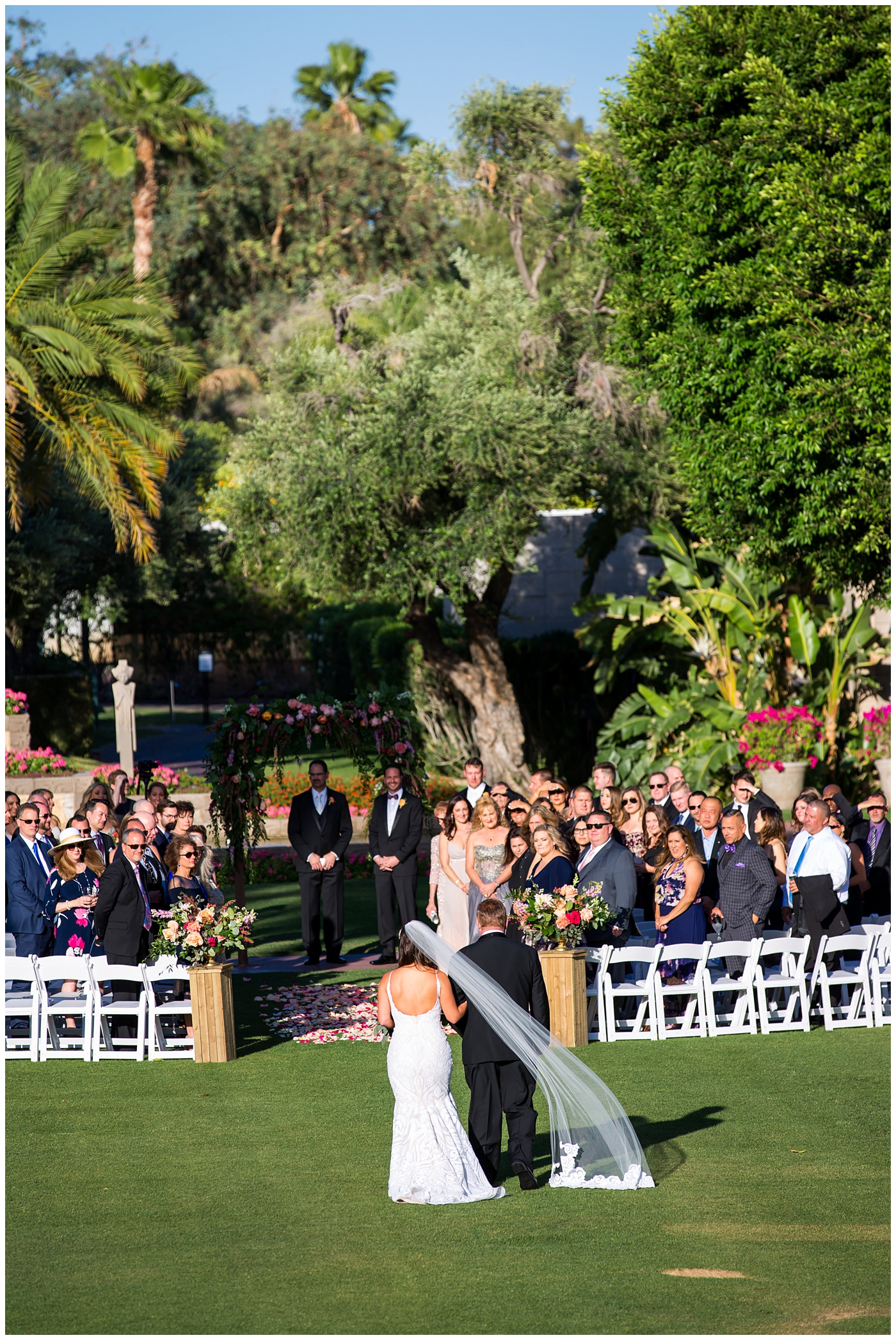 bride walking down the aisle at outdoor wedding ceremony