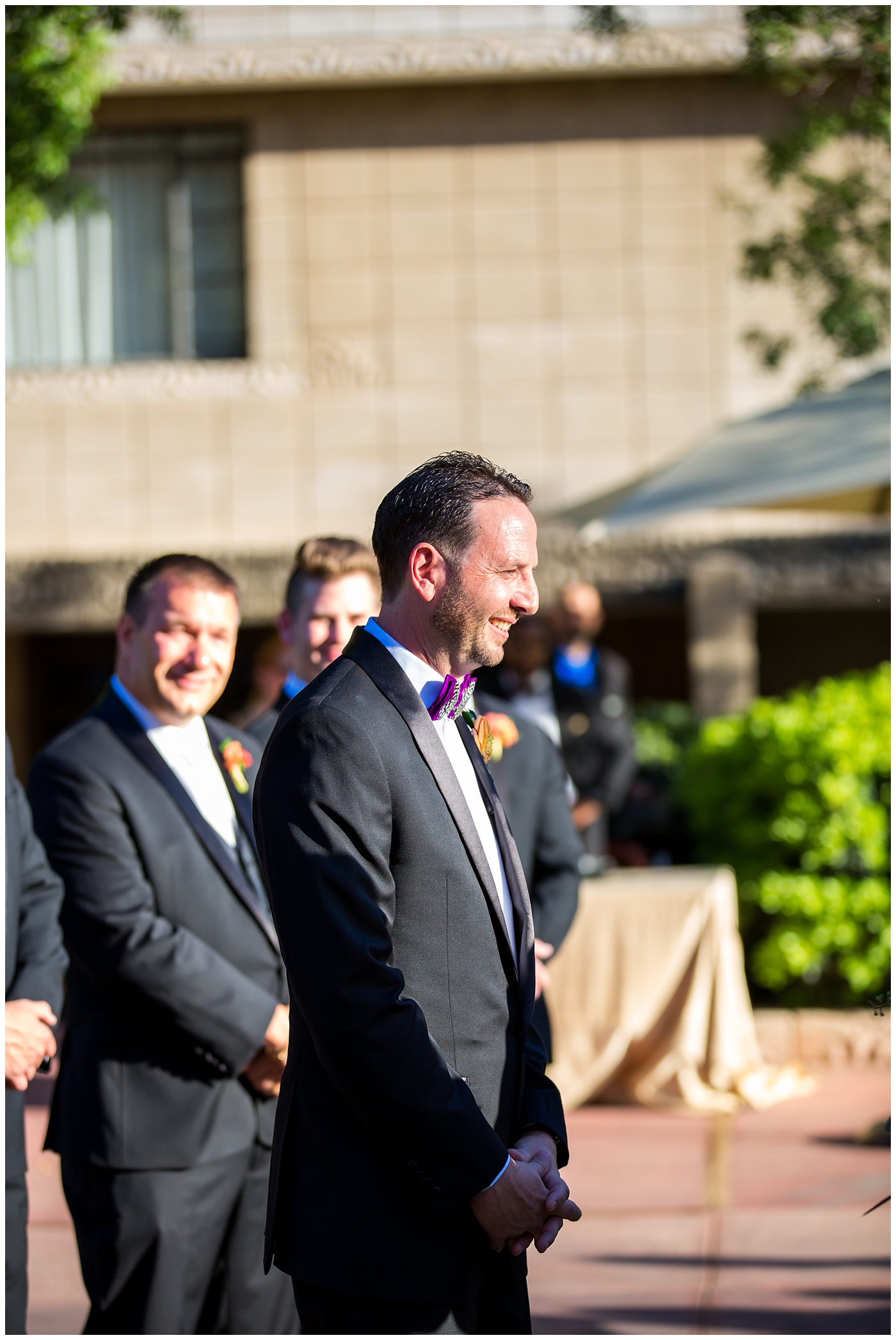 groom seeing bride walk down the aisle at outdoor wedding ceremony