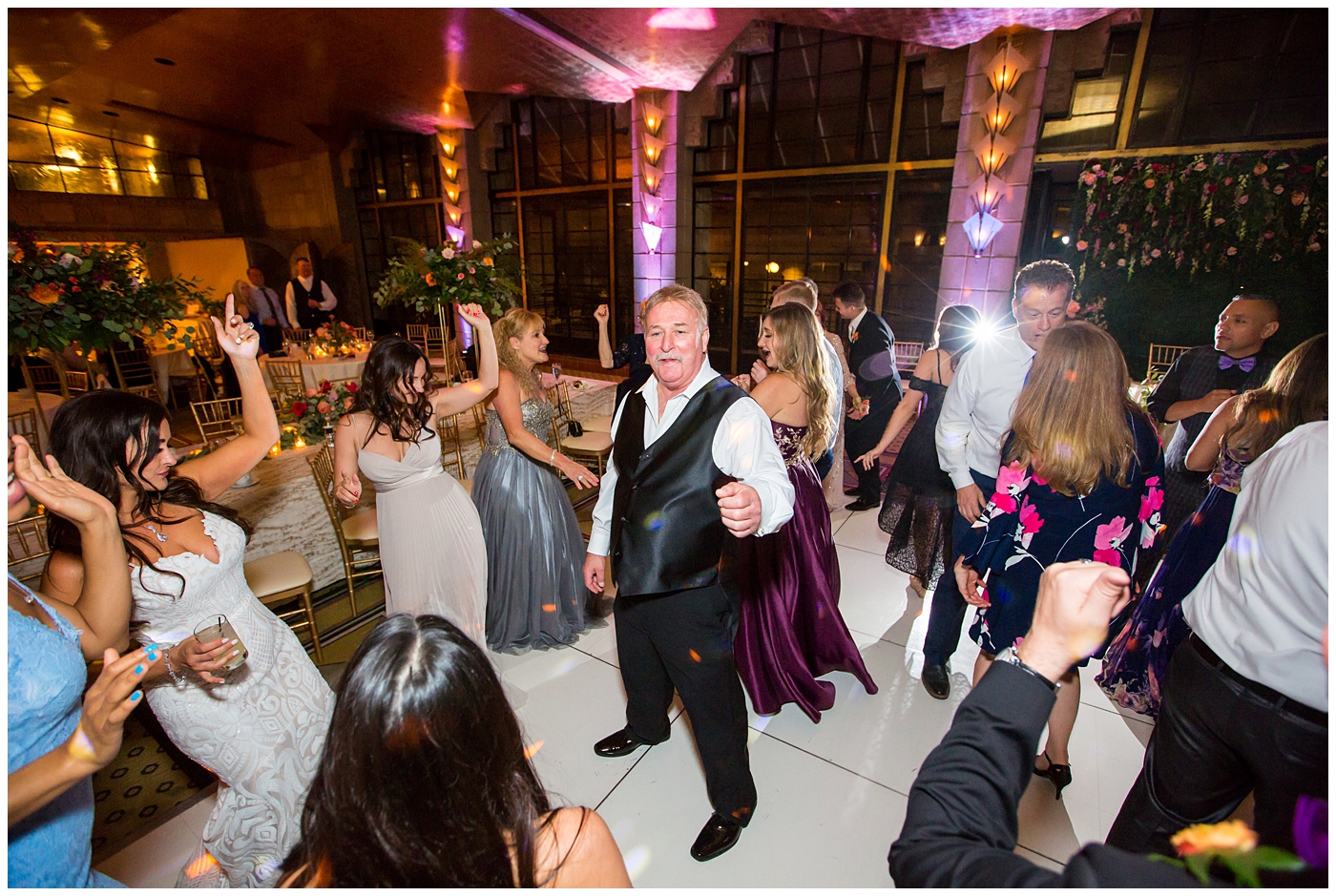 wedding guests dancing at ballroom wedding reception