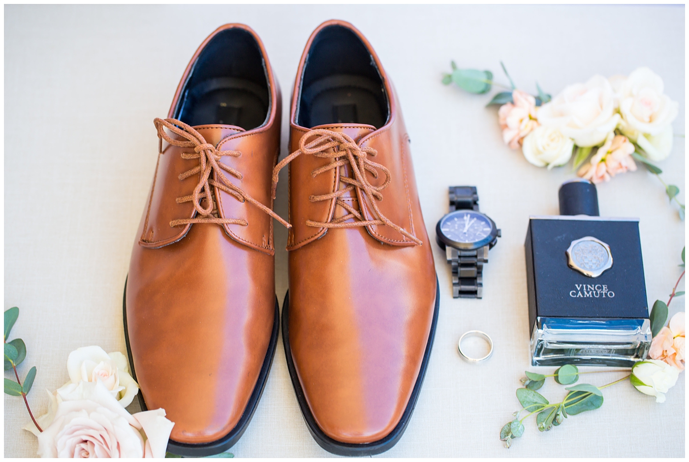 groom's light brown shoes with watch and cologne on wedding day details