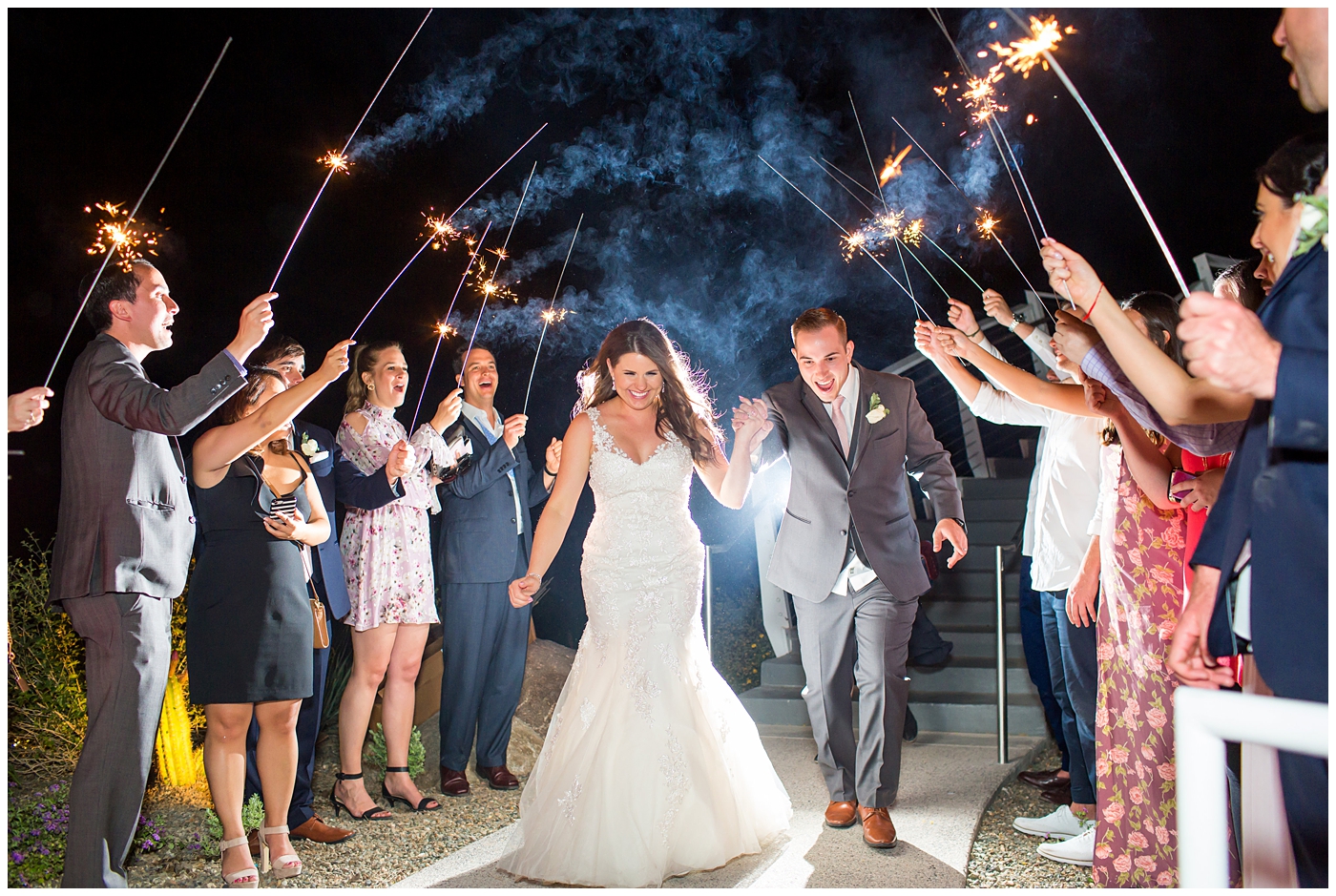 bride and groom during sparkler exit at end of outdoor wedding reception