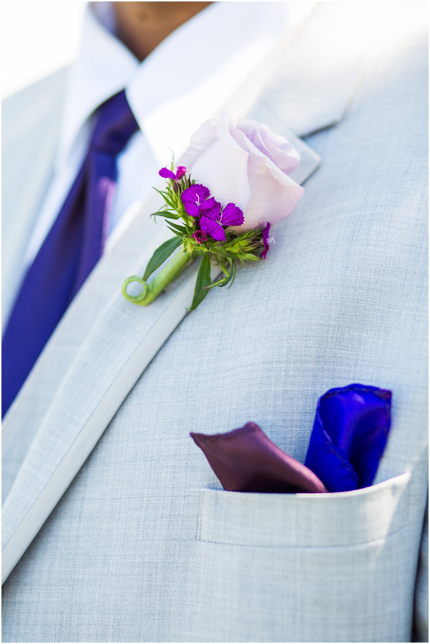 light grey suit with dark purple tie and lavender rose boutonniere groomsman 
