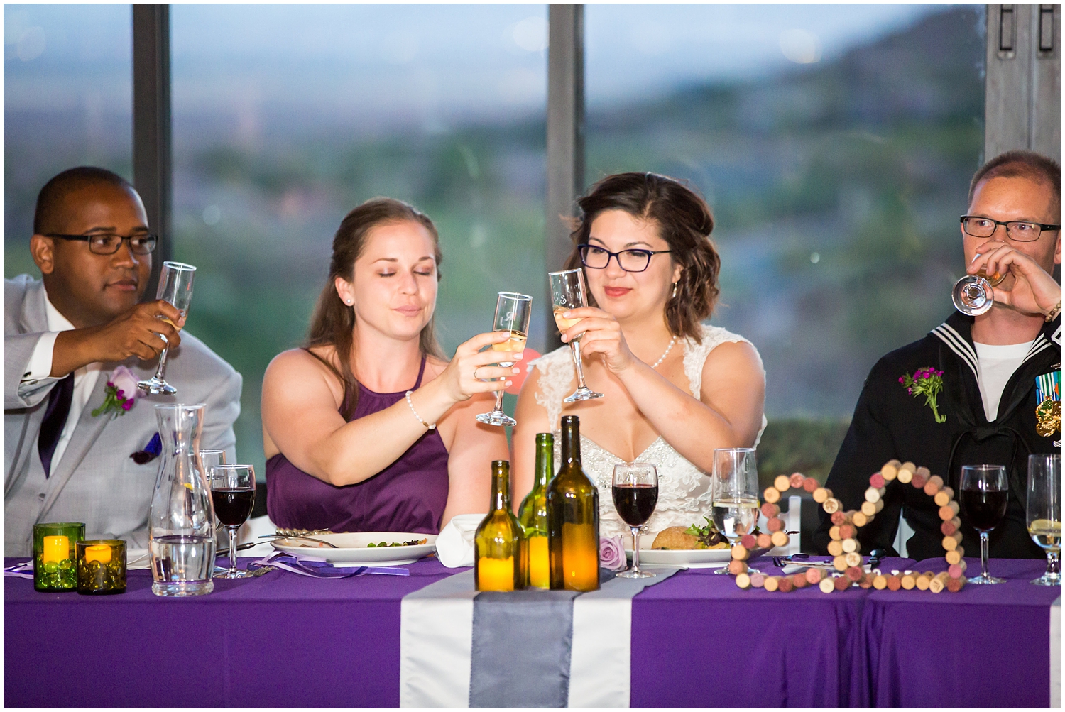 bride and bridesmaid toasting during wedding reception