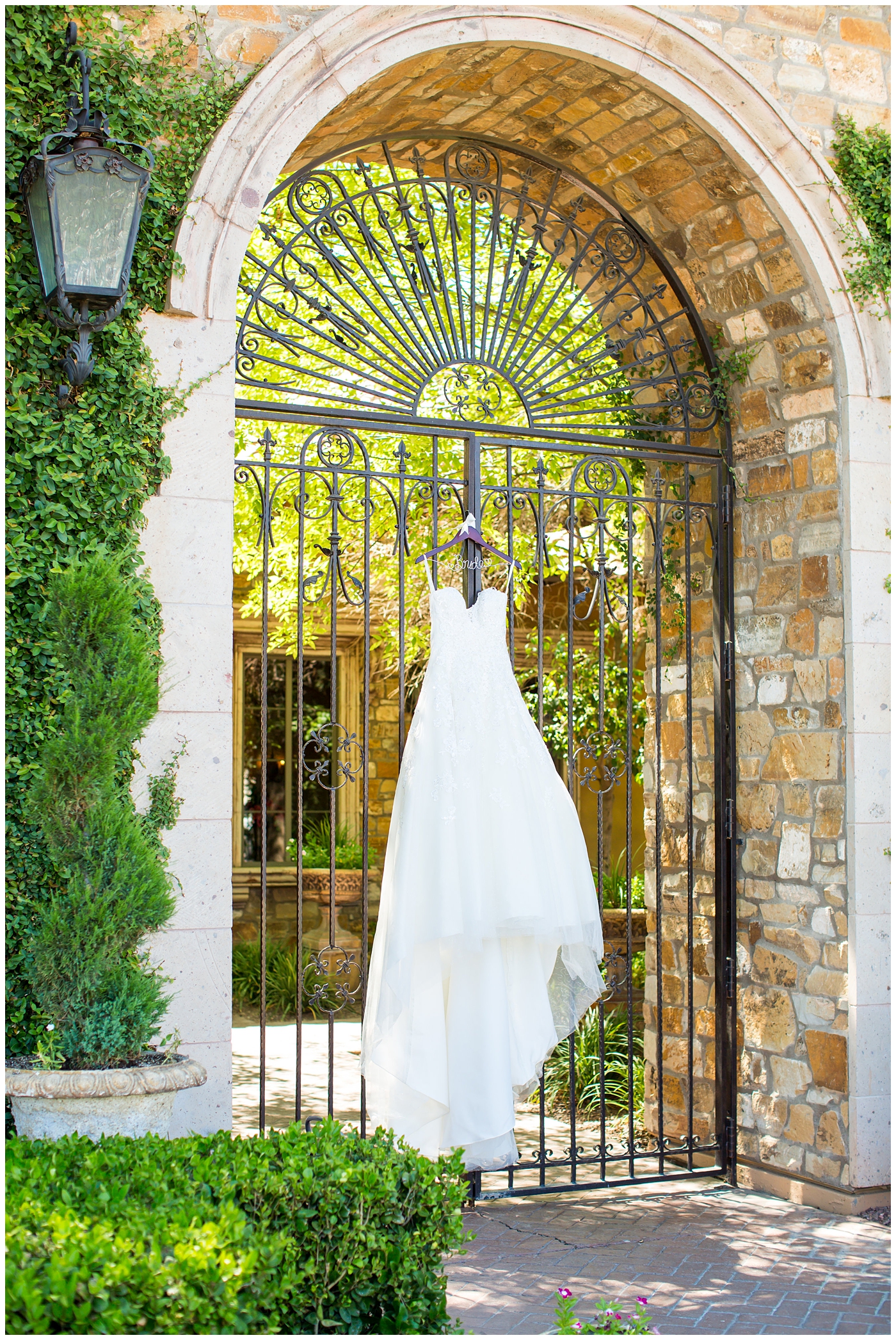 white strapless dress detail shot hanging in doorway