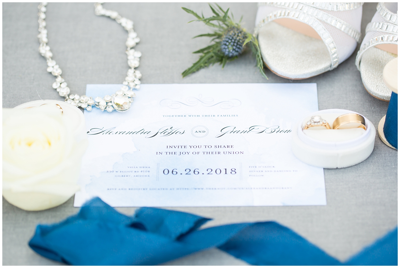 blue watercolor wedding invitation suite with rings and jewelry wedding detail shot