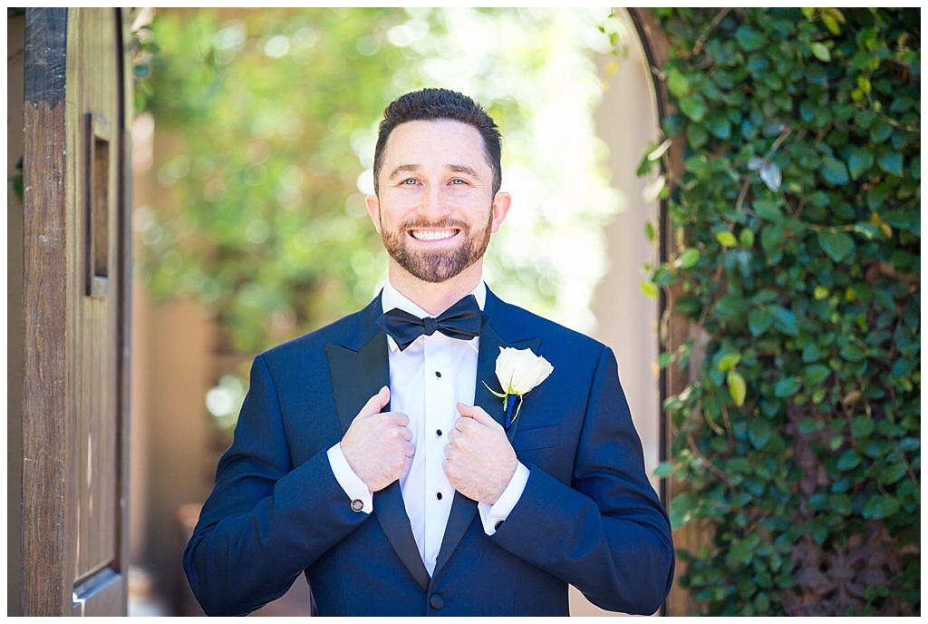 groom in navy blue suit at the montelucia