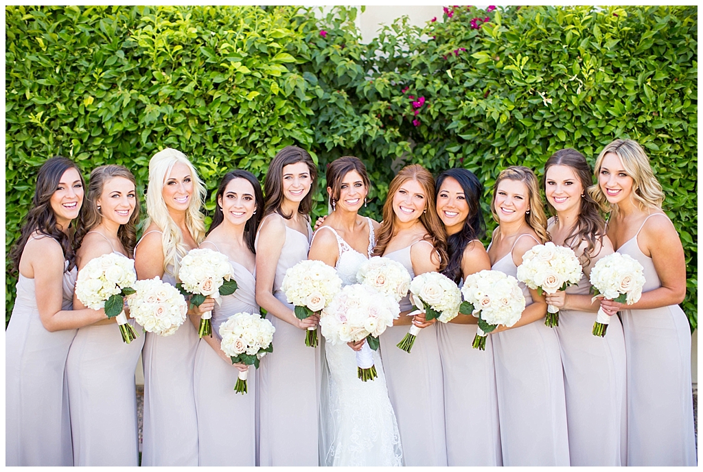 bride with bridesmaids in mauve blush dresses at Montelucia