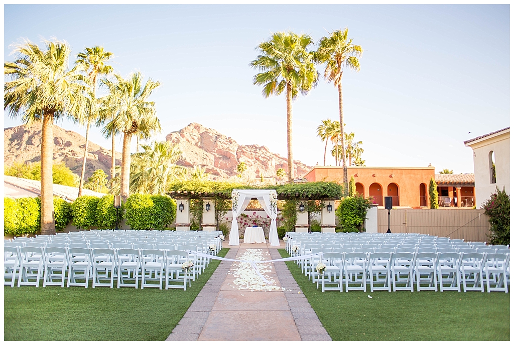 ceremony set up with Camelback view with whote rose petals down the aisle at Omni Montelucia wedding