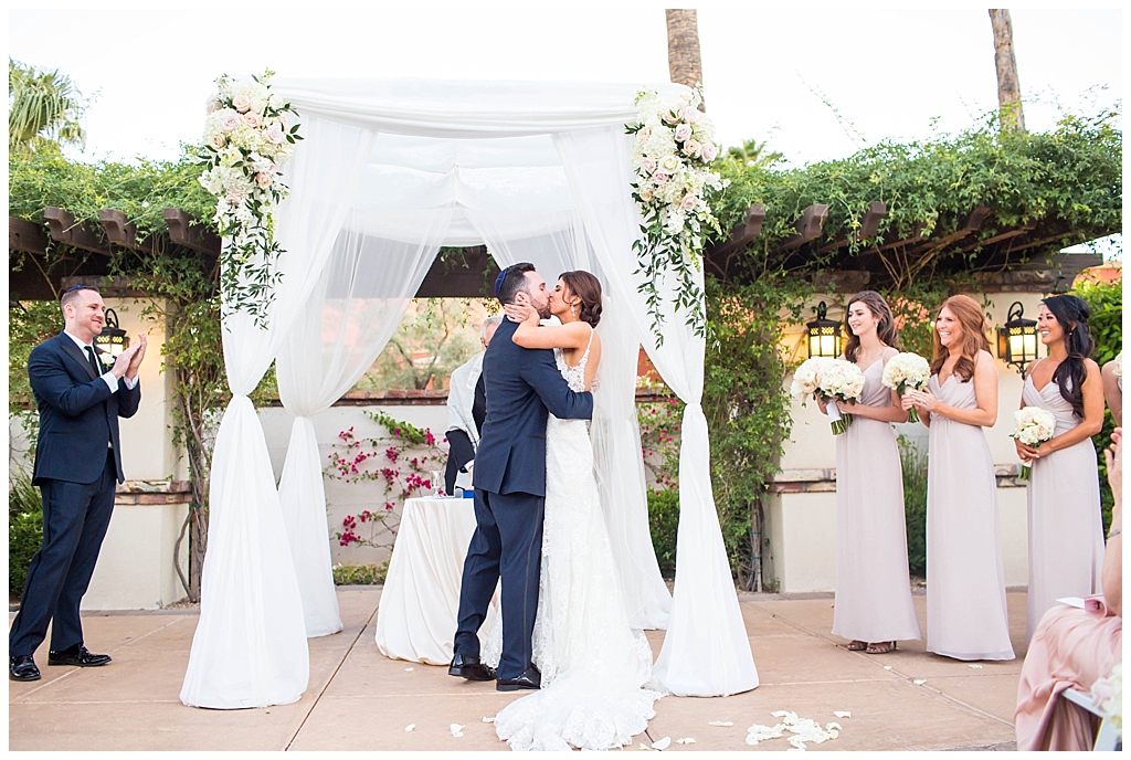 bride and groom announced husband and wife first kiss at Omni Montelucia wedding