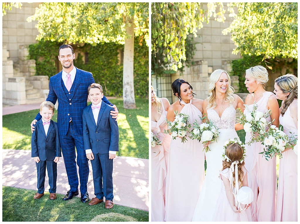 groom with ring bearers in blue suits and bride with bridesmaids in blush dresses