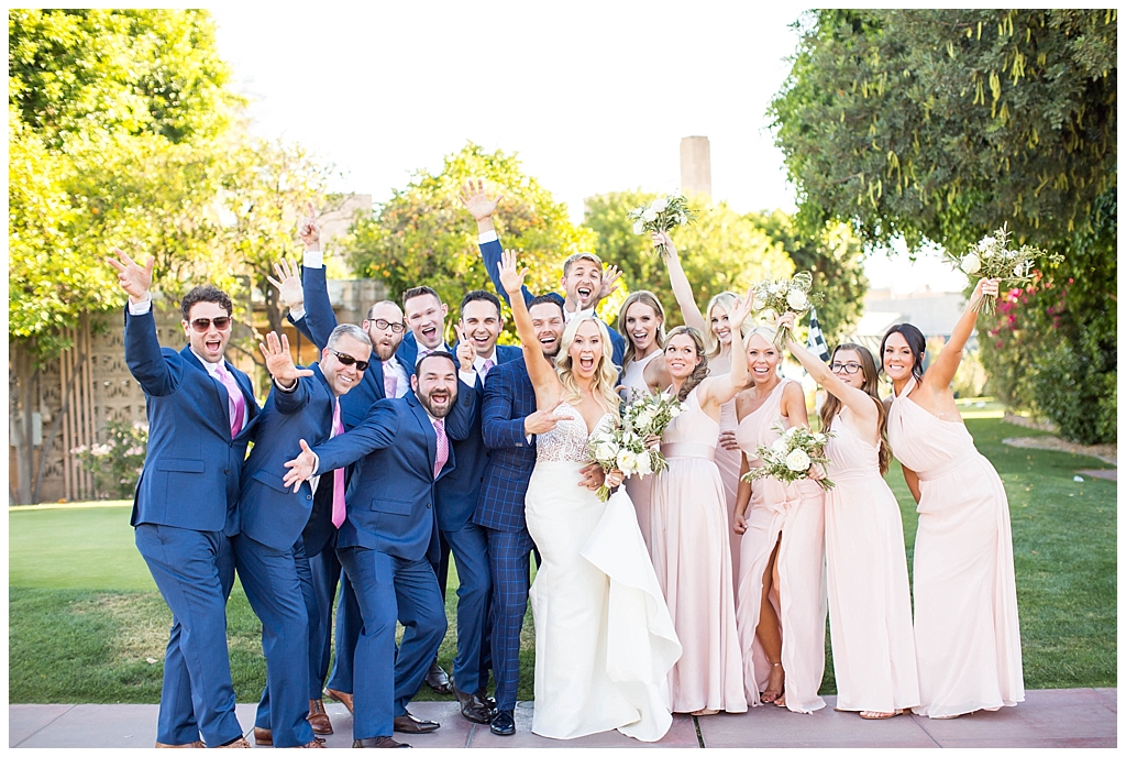 wedding party celebrating in navy and blush