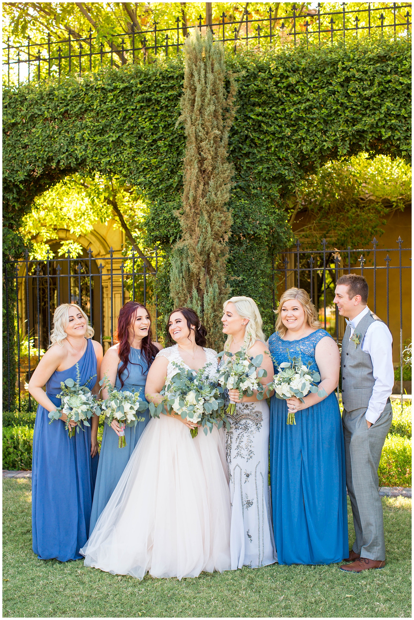 Bridesmaids and bridesman in gray and blue
