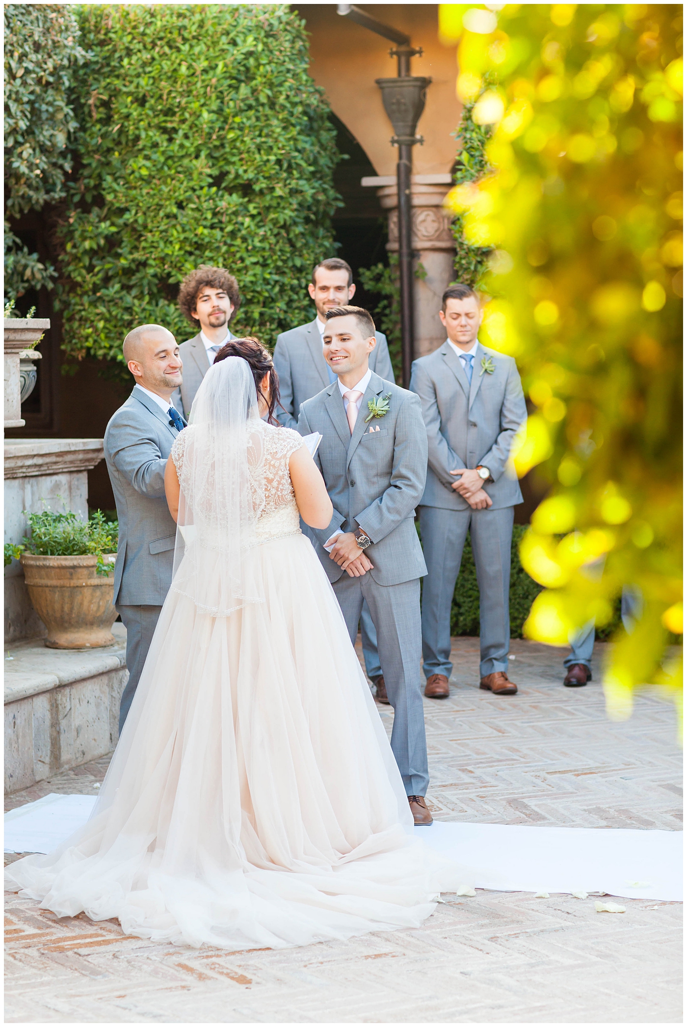 Bride and Groom during ceremony in Tuscan Courtyard