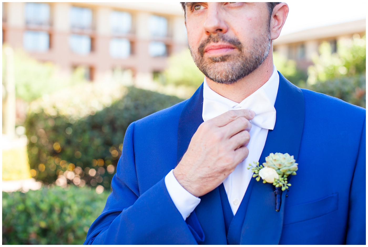 Groom in a custom Brother's Tailors Blue suit