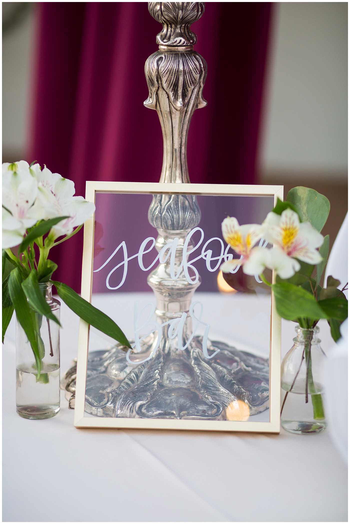 caligraphy on see glass at wedding sign
