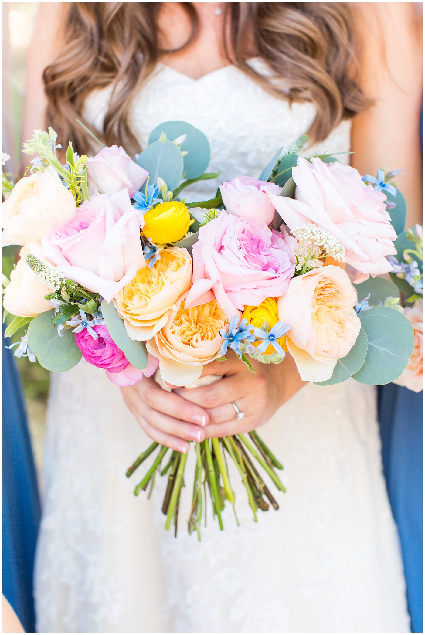 bridal bouquet with pink and orange roses with greenery