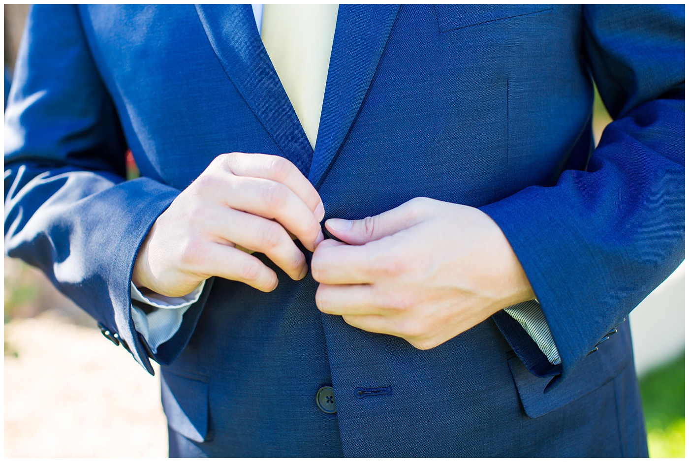 groom in navy blue suit from men's warehouse on wedding day