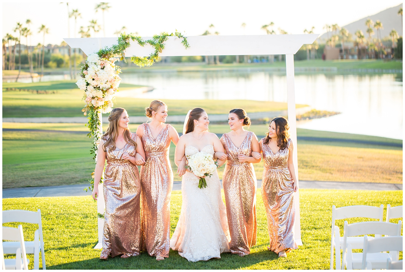 white rose wedding bouquet with bride in lillian lottie couture wedding dress and bridesmaids in rose gold sequin dress