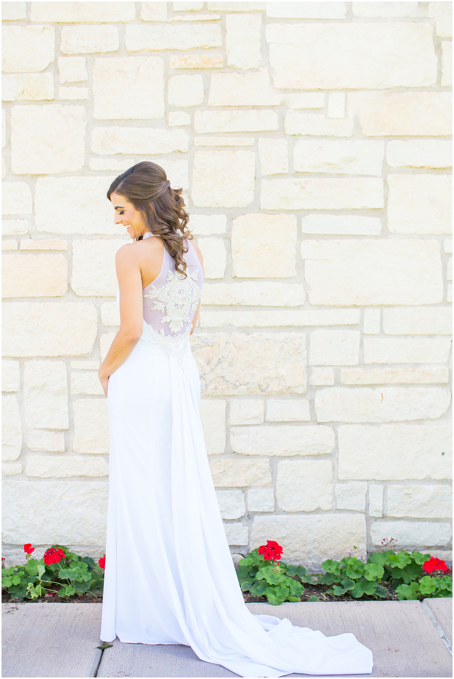 bride in demetrios bridal gown racerback with sheer beading getting ready on wedding day