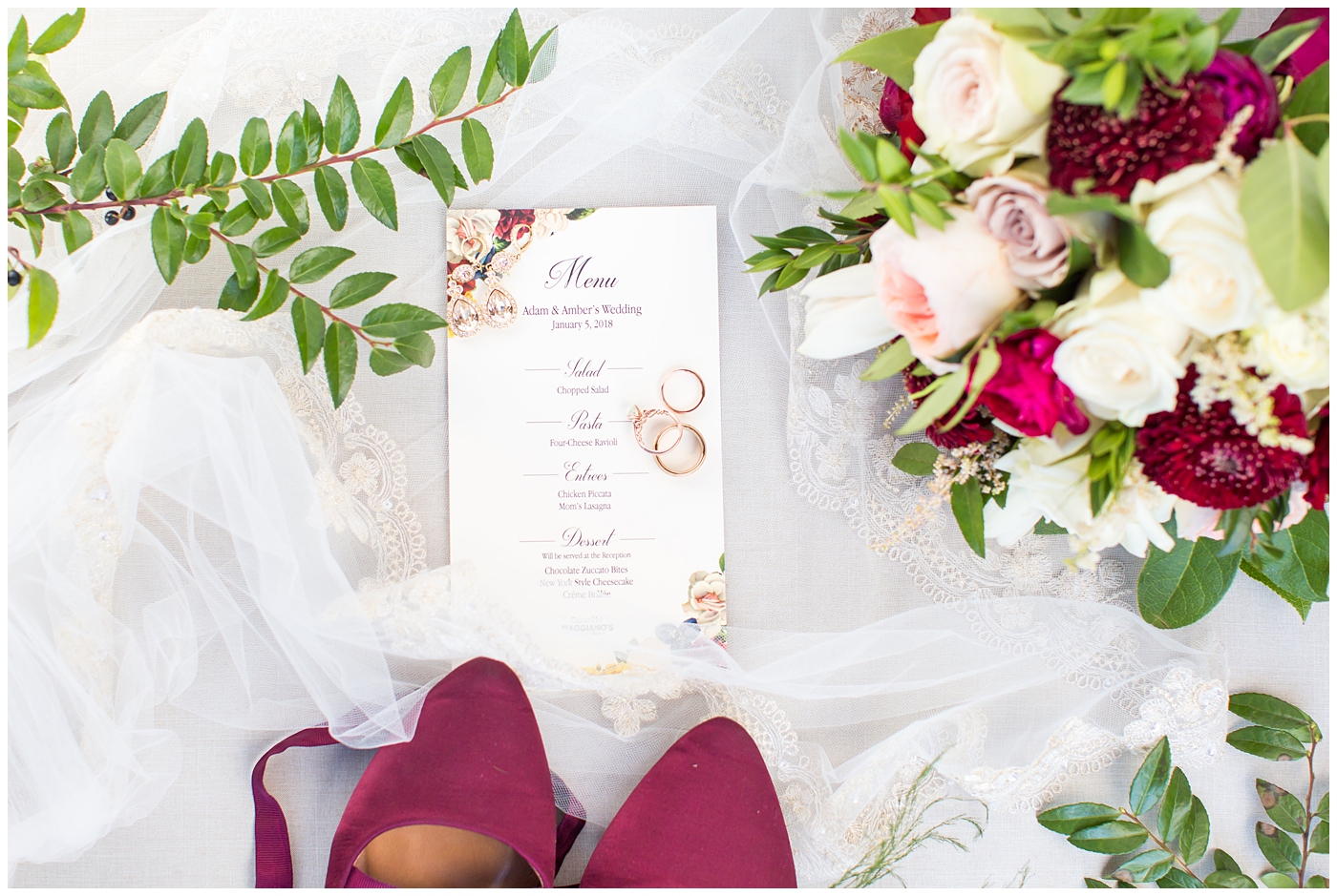 wedding invite with burgundy florals with rose gold wedding rings and bands with bride's burgundy tie up ballet flats wedding day details
