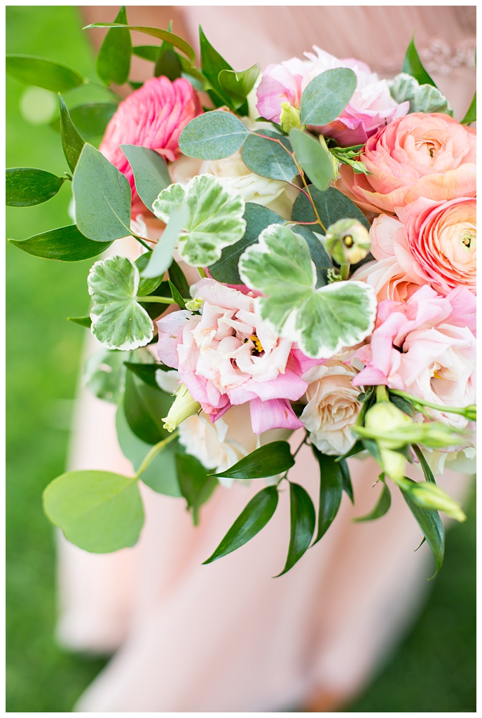 white, pink and orange ranunculus flowers and greenery bouquet wedding day